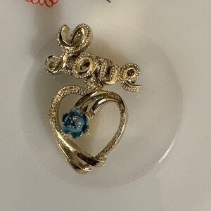 Vintage Silver Dangling Heart Brooch with Blue Flower Accent